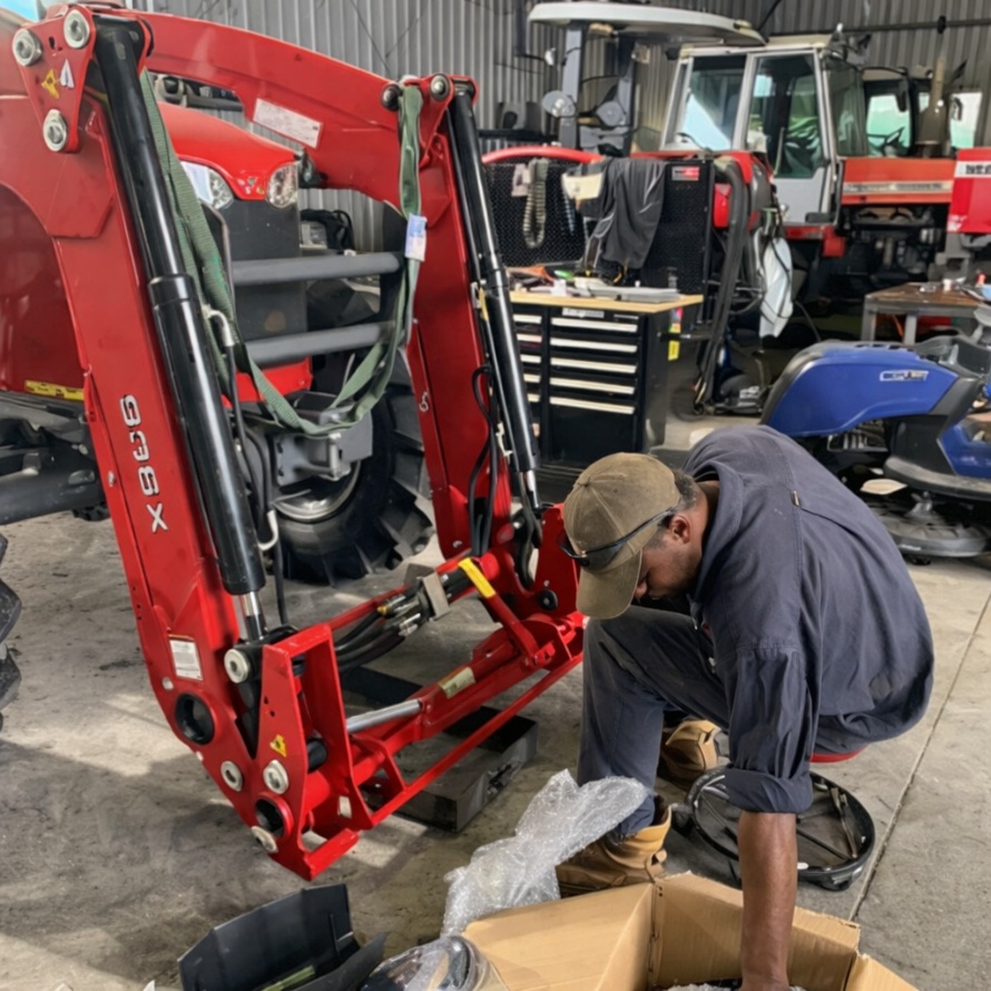 Tractor loader servicing and maintenance