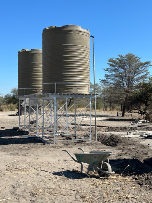 Ioma Village community water point with solar pumping and elevated tanks
